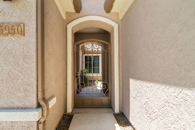 5950 S Hoptree Pl, Tucson, AZ 85747 - entrance to property featuring stucco siding