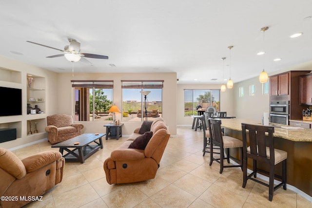 5950 S Hoptree Pl, Tucson, AZ 85747 - living room with plenty of natural light, built in shelves, light tile patterned flooring, a ceiling fan, and recessed lighting