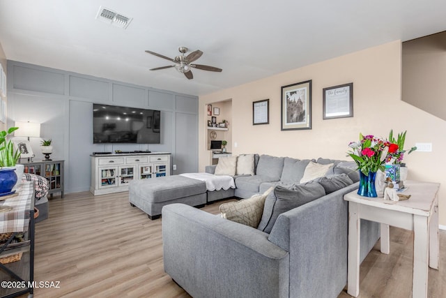 14247 E Axle Dr, Vail, AZ 85641 - living area with a ceiling fan, light wood-style flooring, and baseboards