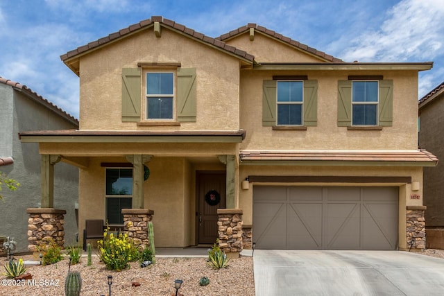 14247 E Axle Dr, Vail, AZ 85641 - view of front of home with a porch, concrete driveway, an attached garage, stucco siding, and stone siding