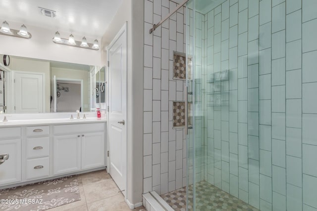 14247 E Axle Dr, Vail, AZ 85641 - bathroom with a shower stall, tile patterned flooring, and double vanity