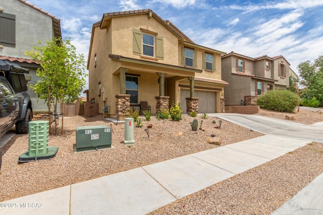 14247 E Axle Dr, Vail, AZ 85641 - view of front of home with an attached garage, stucco siding, driveway, and a residential view