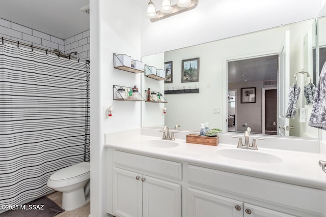 14247 E Axle Dr, Vail, AZ 85641 - bathroom with double vanity, toilet, and a shower with shower curtain