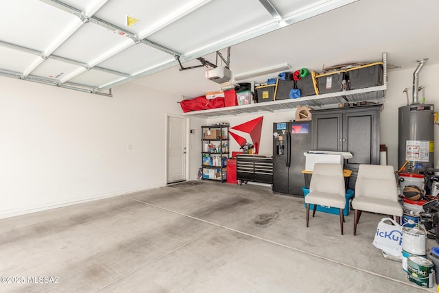 14247 E Axle Dr, Vail, AZ 85641 - garage featuring water heater, black fridge with ice dispenser, and a garage door opener