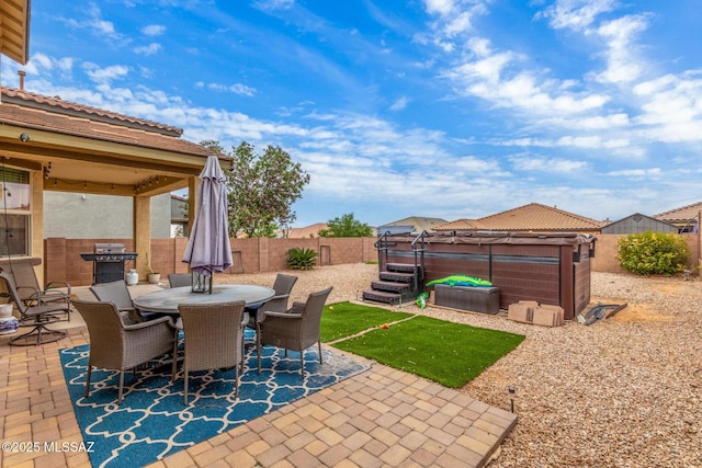 14247 E Axle Dr, Vail, AZ 85641 - view of patio with a hot tub, a fenced backyard, a gazebo, and outdoor dining space