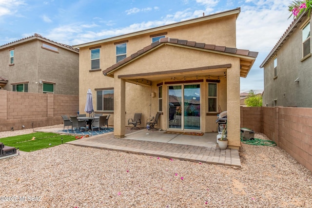 14247 E Axle Dr, Vail, AZ 85641 - back of house featuring stucco siding, a fenced backyard, and a patio