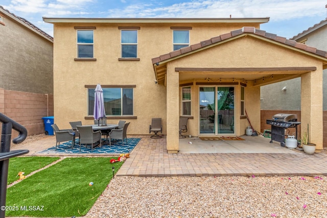 14247 E Axle Dr, Vail, AZ 85641 - rear view of property with stucco siding, fence, and a patio area
