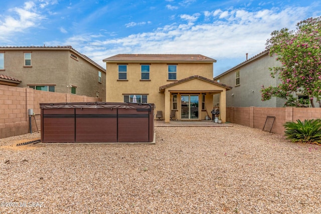 14247 E Axle Dr, Vail, AZ 85641 - rear view of property with a hot tub, stucco siding, a fenced backyard, and a patio area