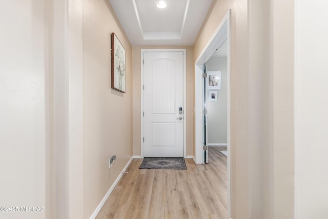 14247 E Axle Dr, Vail, AZ 85641 - doorway with light wood-type flooring, baseboards, and a raised ceiling