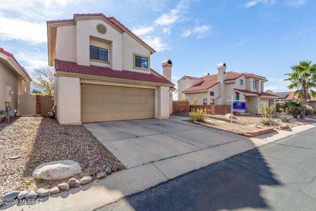 681 W Mountain Ridge Dr, Oro Valley, AZ 85737 - view of front facade featuring stucco siding, a garage, a tiled roof, and driveway