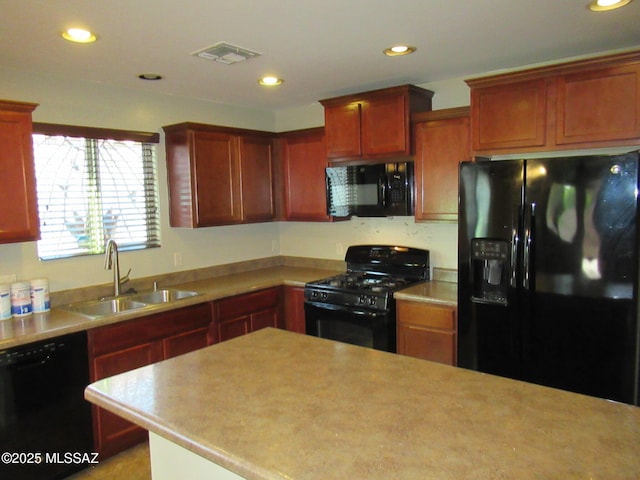 6700 S Stone Fly Dr, Tucson, AZ 85757 - kitchen with black appliances, a sink, light countertops, and recessed lighting