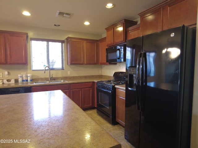 6700 S Stone Fly Dr, Tucson, AZ 85757 - kitchen with black appliances, a sink, recessed lighting, and light countertops