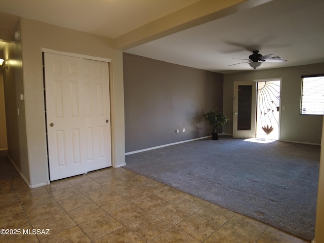 6700 S Stone Fly Dr, Tucson, AZ 85757 - unfurnished room featuring carpet floors, ceiling fan, baseboards, and tile patterned floors