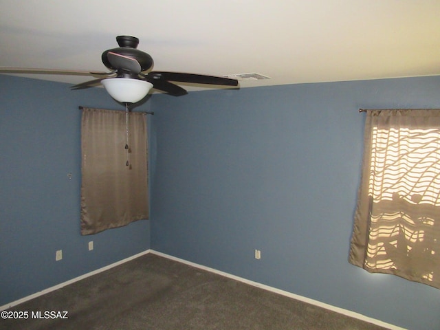 6700 S Stone Fly Dr, Tucson, AZ 85757 - unfurnished room with a ceiling fan, baseboards, and carpet