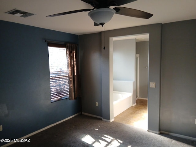 6700 S Stone Fly Dr, Tucson, AZ 85757 - unfurnished bedroom with carpet floors, baseboards, and a ceiling fan