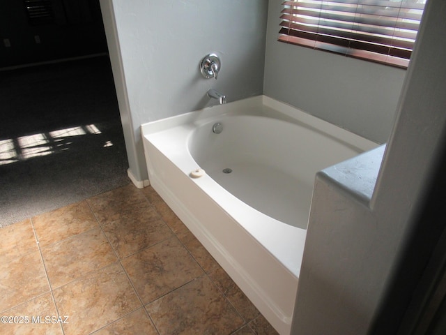6700 S Stone Fly Dr, Tucson, AZ 85757 - bathroom featuring a bath and baseboards