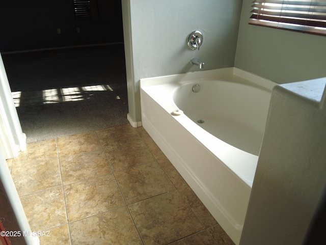 6700 S Stone Fly Dr, Tucson, AZ 85757 - bathroom featuring a garden tub and baseboards