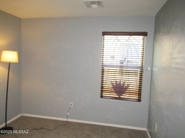 6700 S Stone Fly Dr, Tucson, AZ 85757 - carpeted spare room with plenty of natural light and baseboards