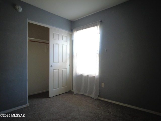 6700 S Stone Fly Dr, Tucson, AZ 85757 - unfurnished bedroom with carpet, a closet, and baseboards