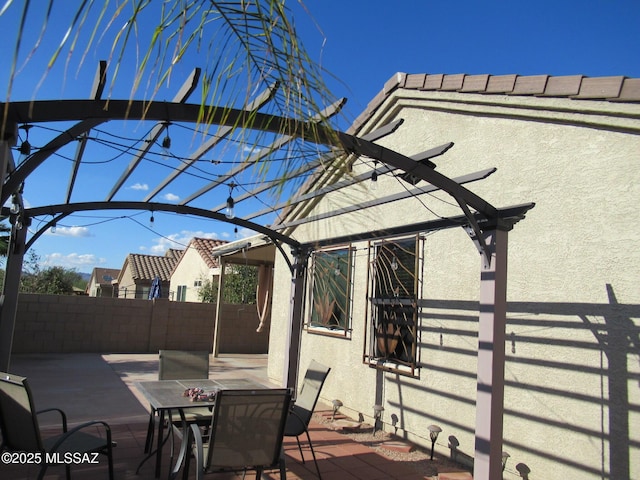 6700 S Stone Fly Dr, Tucson, AZ 85757 - fenced backyard with outdoor dining space and a pergola