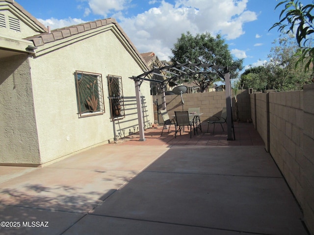 6700 S Stone Fly Dr, Tucson, AZ 85757 - fenced backyard with a pergola, a patio area, and outdoor dining space