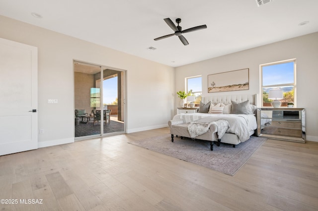 bedroom featuring access to outside, wood finished floors, baseboards, and a ceiling fan