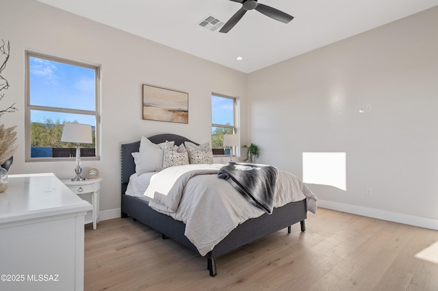 bedroom featuring baseboards, light wood-style floors, a ceiling fan, and recessed lighting