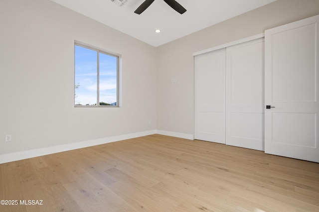 unfurnished bedroom with light wood-type flooring, baseboards, a closet, recessed lighting, and ceiling fan