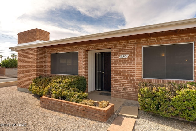 5301 E 4th St, Tucson, AZ 85711 - property entrance with brick siding and a chimney