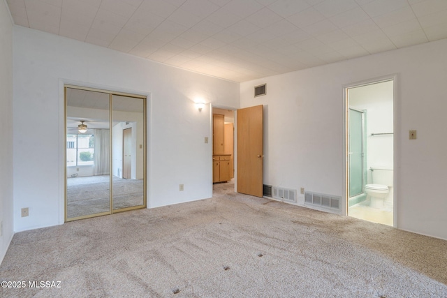 5301 E 4th St, Tucson, AZ 85711 - unfurnished bedroom with carpet flooring, ensuite bath, and a closet