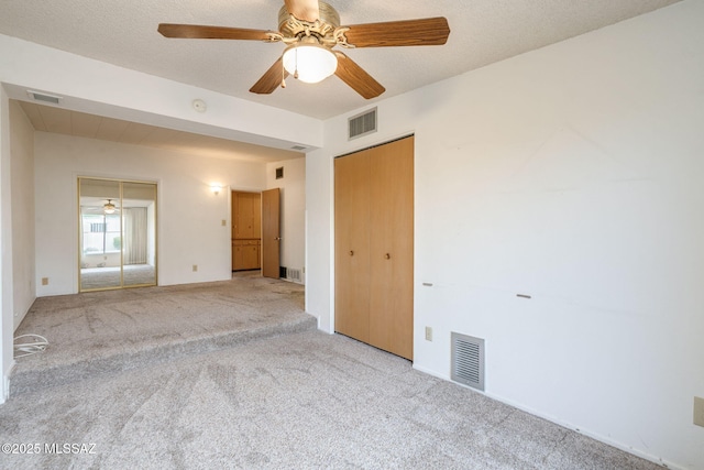 5301 E 4th St, Tucson, AZ 85711 - unfurnished bedroom featuring carpet flooring and ceiling fan