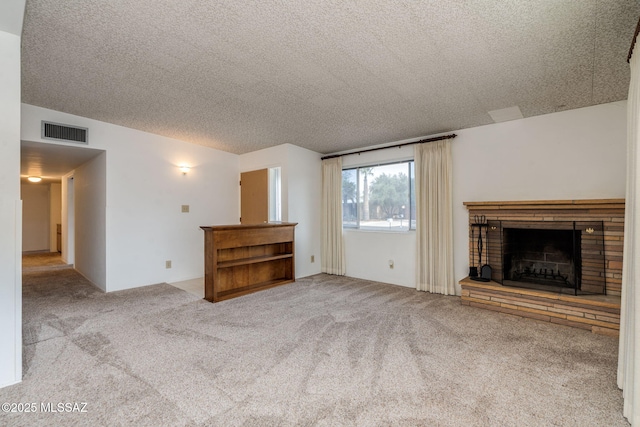 5301 E 4th St, Tucson, AZ 85711 - unfurnished living room with a fireplace, a textured ceiling, and carpet floors