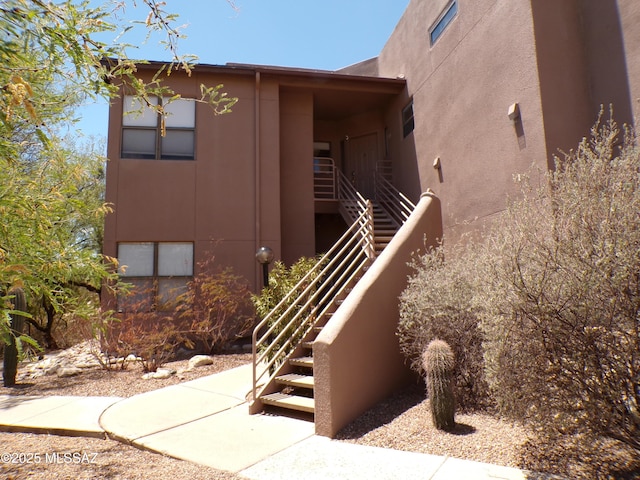 6655 N Canyon Crest Dr Unit 19201, Tucson, AZ 85750 - view of exterior entry with stucco siding