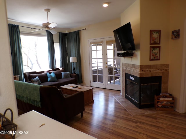 6655 N Canyon Crest Dr Unit 19201, Tucson, AZ 85750 - living area with a ceiling fan, wood finished floors, healthy amount of natural light, and french doors