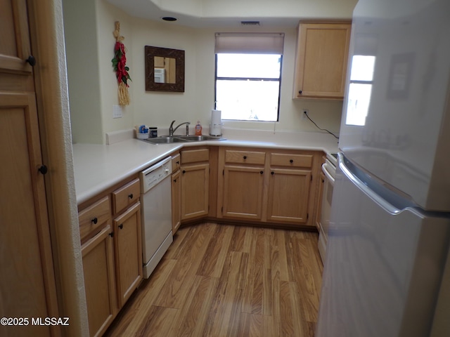 6655 N Canyon Crest Dr Unit 19201, Tucson, AZ 85750 - kitchen featuring white appliances, a sink, light wood-style flooring, and light countertops