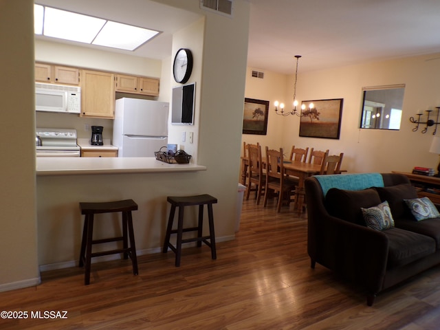6655 N Canyon Crest Dr Unit 19201, Tucson, AZ 85750 - living area with dark wood-style flooring and a chandelier