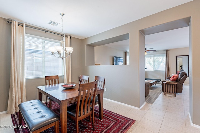 10487 S Cutting Horse Dr, Vail, AZ 85641 - dining room featuring a chandelier, light tile patterned floors, baseboards, and a ceiling fan
