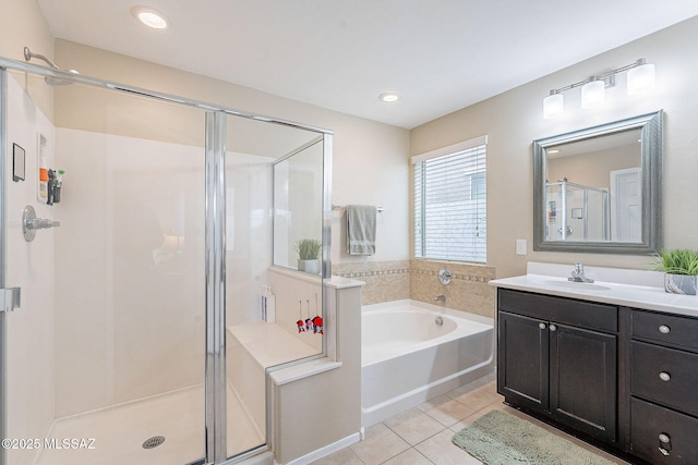 10487 S Cutting Horse Dr, Vail, AZ 85641 - full bath with tile patterned floors, a shower stall, a bath, vanity, and recessed lighting