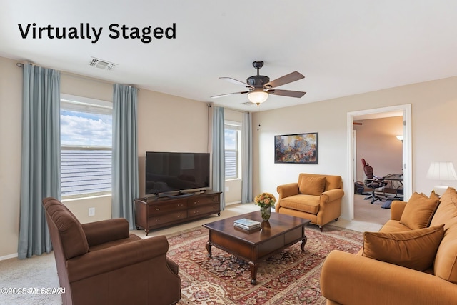 10487 S Cutting Horse Dr, Vail, AZ 85641 - living area with plenty of natural light, a ceiling fan, and light carpet