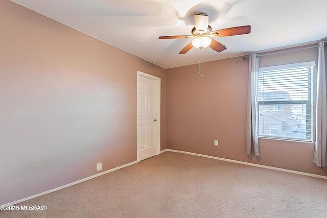 10487 S Cutting Horse Dr, Vail, AZ 85641 - spare room featuring ceiling fan, light colored carpet, and baseboards
