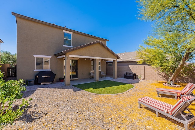 10487 S Cutting Horse Dr, Vail, AZ 85641 - back of house featuring stucco siding, a patio, and a fenced backyard