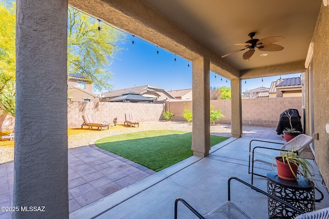 10487 S Cutting Horse Dr, Vail, AZ 85641 - view of patio with a ceiling fan and a fenced backyard