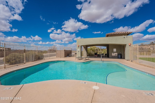 10487 S Cutting Horse Dr, Vail, AZ 85641 - community pool featuring a patio and fence