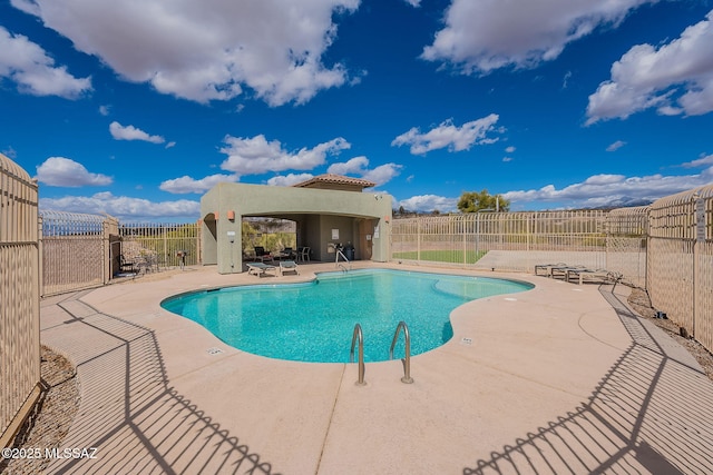 10487 S Cutting Horse Dr, Vail, AZ 85641 - community pool featuring a patio area and fence