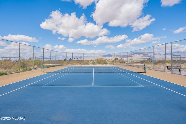 10487 S Cutting Horse Dr, Vail, AZ 85641 - view of tennis court with fence, a mountain view, and community basketball court