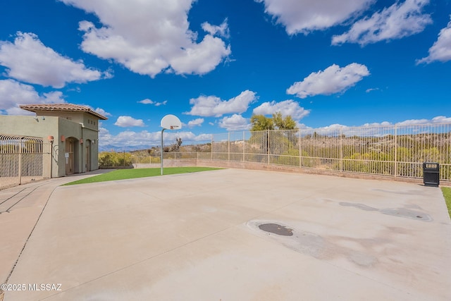 10487 S Cutting Horse Dr, Vail, AZ 85641 - view of patio / terrace featuring community basketball court and fence
