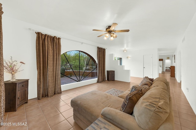 4921 E Camino De Los Olivos, Tucson, AZ 85718 - living area with a ceiling fan and light tile patterned flooring
