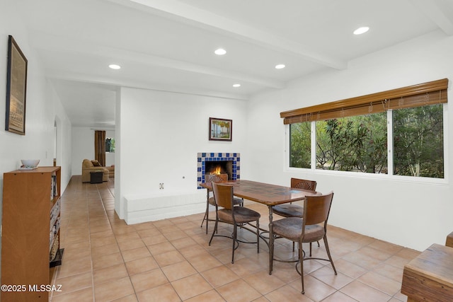 4921 E Camino De Los Olivos, Tucson, AZ 85718 - dining room featuring beam ceiling, a fireplace, light tile patterned floors, and recessed lighting