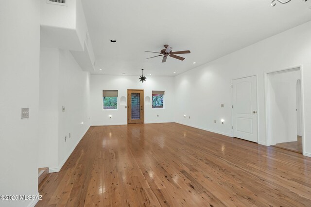 4921 E Camino De Los Olivos, Tucson, AZ 85718 - unfurnished living room featuring a ceiling fan, light wood-type flooring, recessed lighting, and baseboards