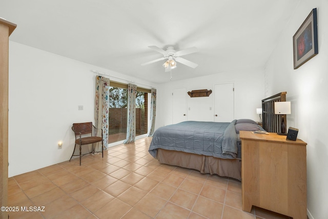 4921 E Camino De Los Olivos, Tucson, AZ 85718 - bedroom with access to outside, light tile patterned floors, and ceiling fan